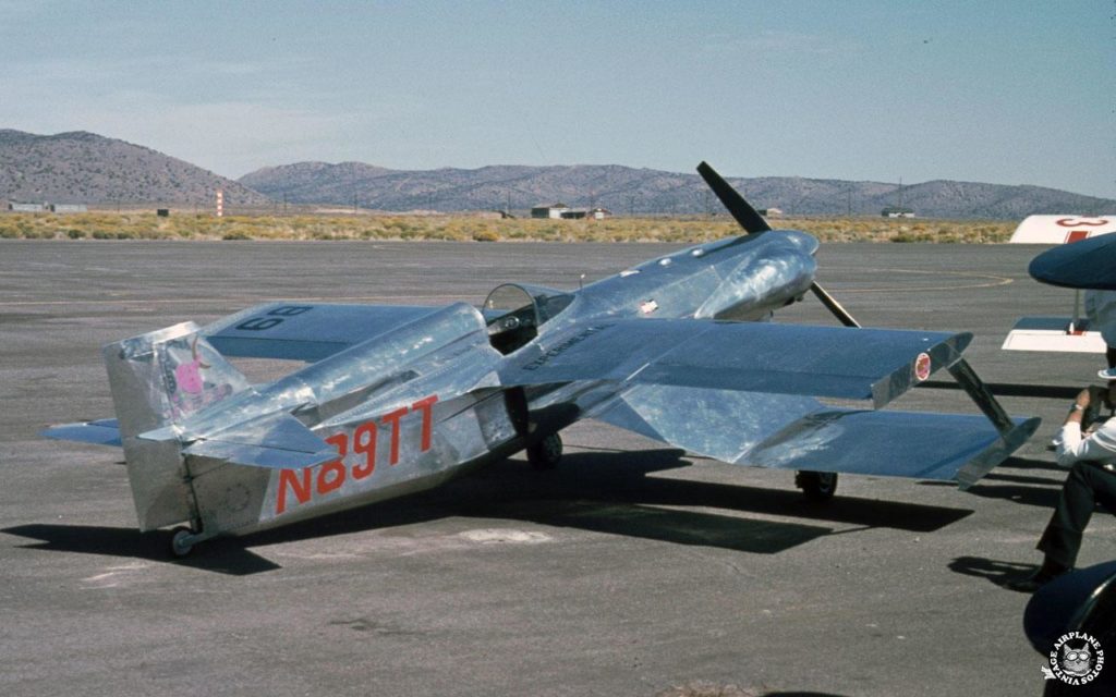 View from the rear and right of Biplane racer #89 Sorceress in polished aluminum